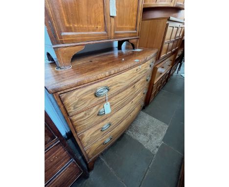 A late Georgian bow front mahogany chest of drawers. 