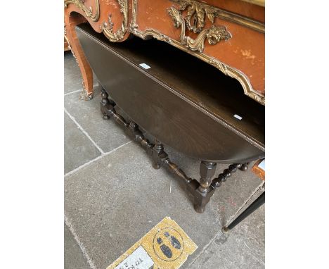 An Ercol dark elm drop leaf coffee table. 