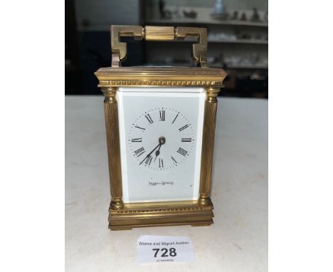 A Mappin &amp; Webb gilt brass carriage clock with key. 