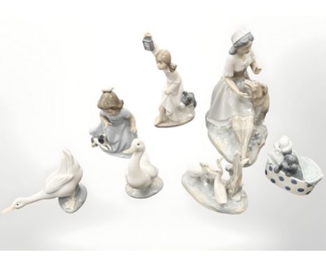 Seven Nao figures and groups, tallest 23cm. (7)