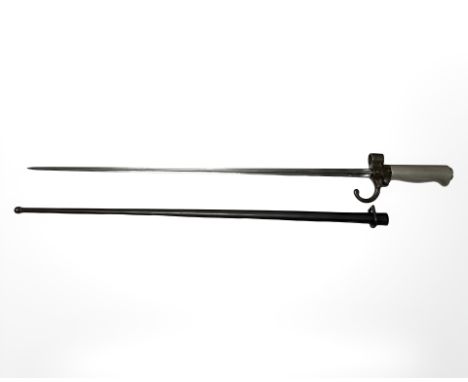 A French Lebel Epee Modele 1886 cruciform blade bayonet with white metal grips, in steel scabbard, early pattern, blade 52 cm