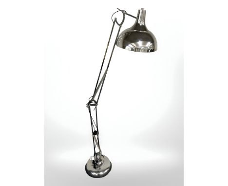 A contemporary chrome plated angle poised floor lamp 