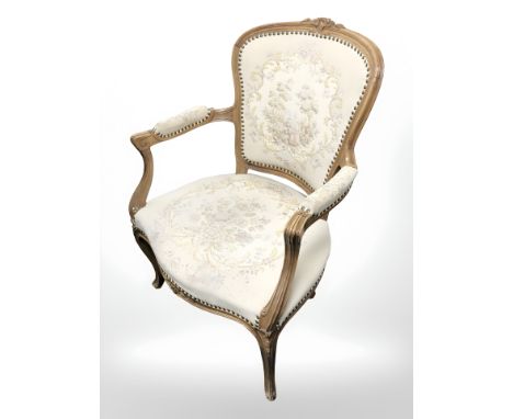 A continental beech tapestry armchair.