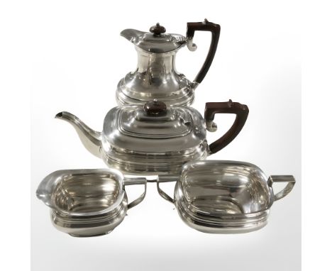 An EPNS four piece tea service, teapot 19 cm high.