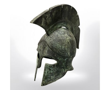 A miniature bronze Greek hoplite helmet, height 15 cm.