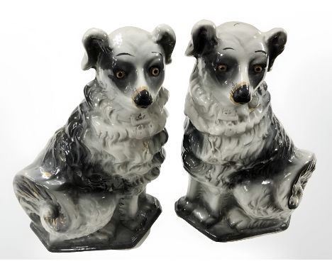 A pair of gilt ceramic fireside dog ornaments, height 31 cm 