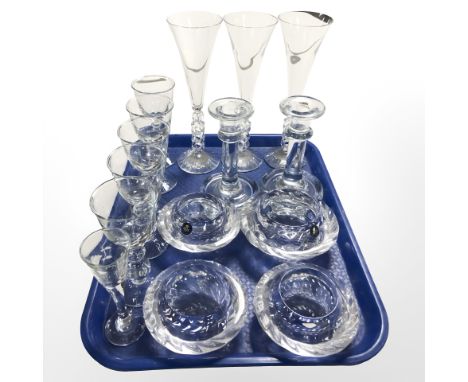 An assortment of continental drinking glasses, four Royal Copenhagen textured glass tea light holders, pair of candlesticks, 