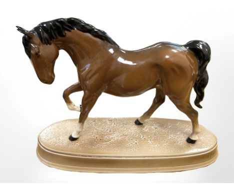 A Beswick horse Spirit of Freedom, brown gloss, on ceramic plinth, height 21cm