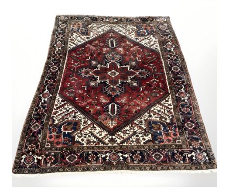 A Heriz carpet, North-West Iran, 290 cm x 197 cm.
