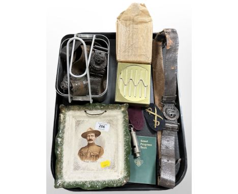 A quantity of boy scout related items, including a transfer printed dish depicting Baden Powell, belts with buckles, progress