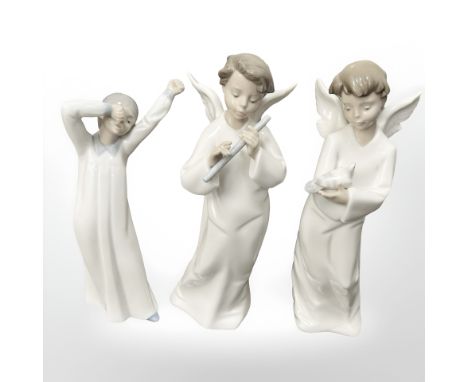 Three Nao figures of boys, two with angel wings, tallest 24cm. (3)