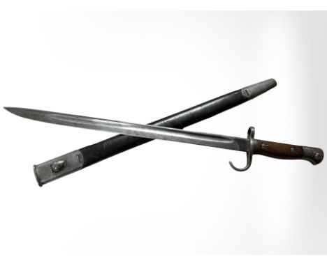 A British Military pattern 1907 sword bayonet with steel-mounted leather scabbard, early pattern with quillon, wood grips, st