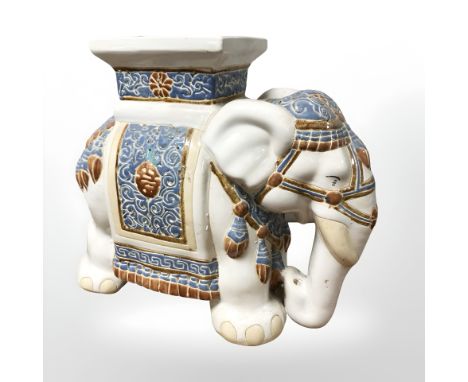 A ceramic elephant plant stand, height 44 cm.