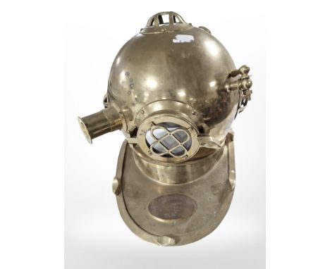A reproduction brass U.S Navy diving helmet. 
