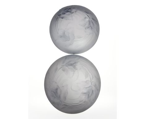 A pair of Art Deco blue frosted glass circular light shades depicting flowers in relief, diameter 34 cm 