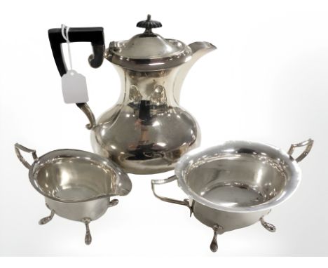 An EPNS three piece tea service, teapot 23 cm high.