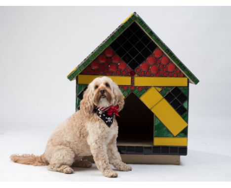 This gorgeous Jamaican-themed kennel by Florida artists Dee Rodriques and Silas Beach is made with a wood frame and is entire