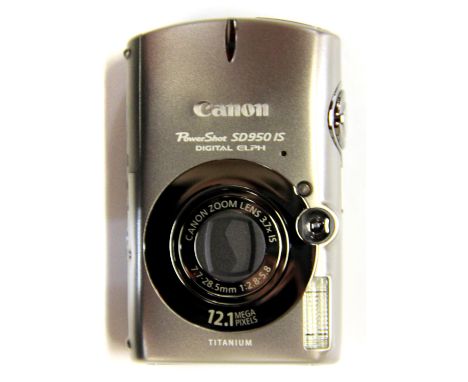 A boxed Canon camera with charger and accessories. Please note this is a credit card reclaim item sold as seen and without re