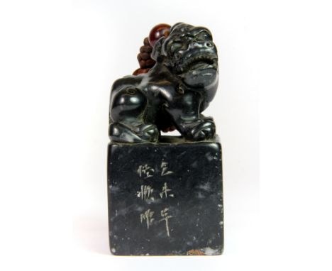 A mid 20th century Chinese carved black soapstone seal, H. 9cm.