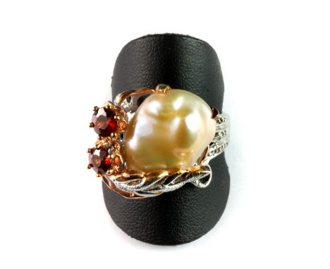 A Hana Maae designer 925 silver gilt ring set a large baroque pearl and garnets, (U).