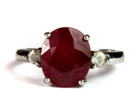 A 925 silver ring set with an oval cut ruby and white stones (N.5).