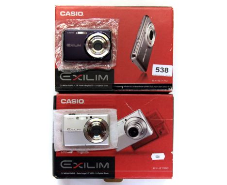 Two boxed Casio Exilium cameras with chargers and other accessories. Please note this is a credit card reclaim item sold as s
