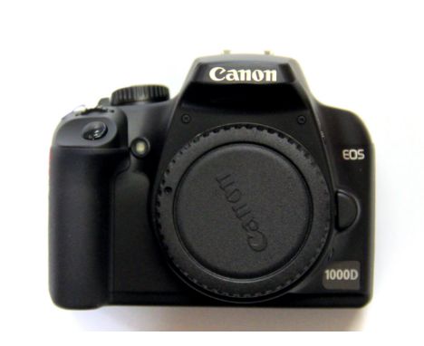A boxed Canon camera with charger and accessories. Please note this is a credit card reclaim item sold as seen and without re