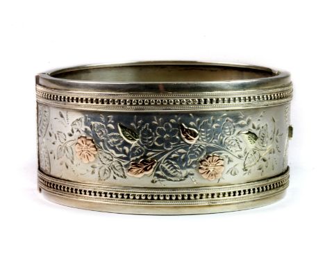 A hallmarked silver gilt bangle, L. 5.8cm.