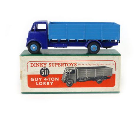 A Dinky Super Toys Guy four tonne lorry, number 511, with royal blue painted cab and sky blue bed in original box  CONDITION 