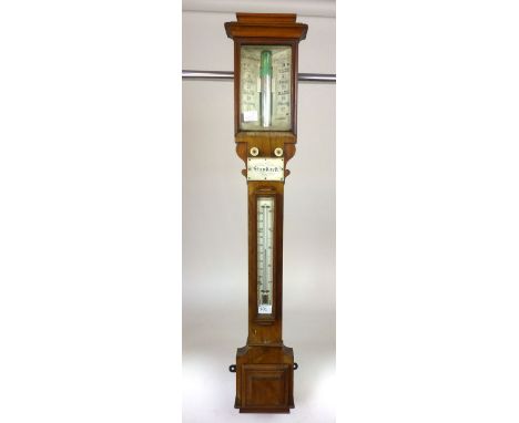 An early 19th century stick barometer with weather gauge and thermometer behind beveled glass along with ivory turned knobs a