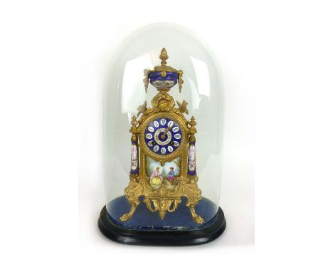 A 19th century French gilt metal and enameled eight day mantle clock under glass dome. h. 48 cm, w. 31 cm. d. 20 cm CONDITION