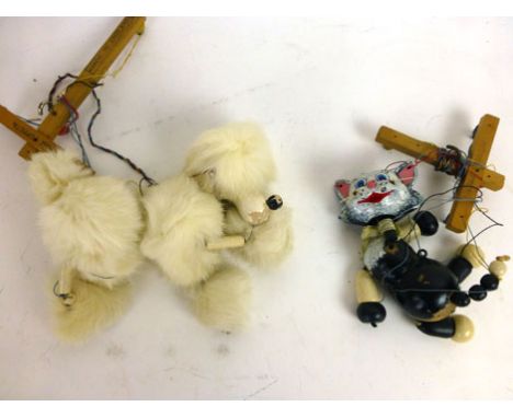 A Pelham puppet of poodle and cat  CONDITION REPORT: Play worn condition. Chips to paint, losses to paint etc 