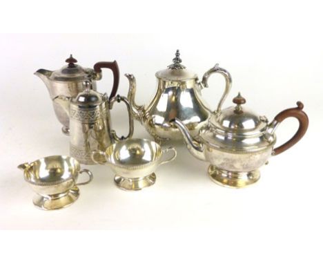 A silver plated four piece tea service, together with two other plated teapots