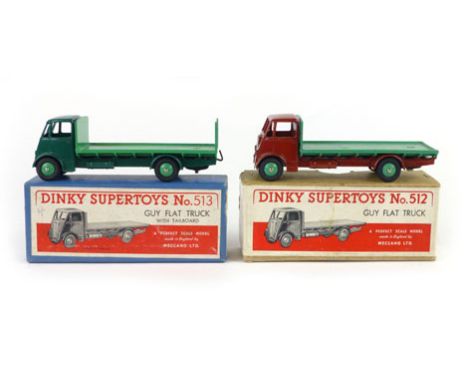 A Dinky Super Toys, number 513, Guy flatbed truck with tailboard, dark green cab and green bed together with Dinky Super Toys