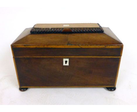 A Regency mahogany and boxwood tea caddy, the top opening to reveal fitted interior with two tea compartments and bowl holder