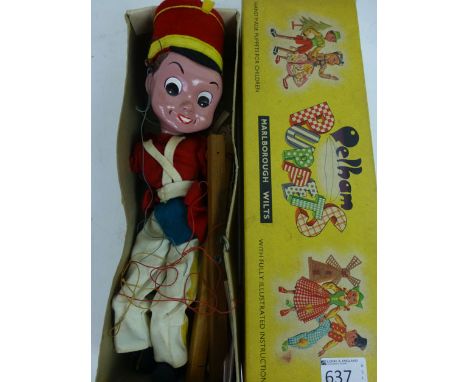 A boxed Pelham puppet SL Bom in original box  CONDITION REPORT: Appears complete. Slight play worn condition. Original named 