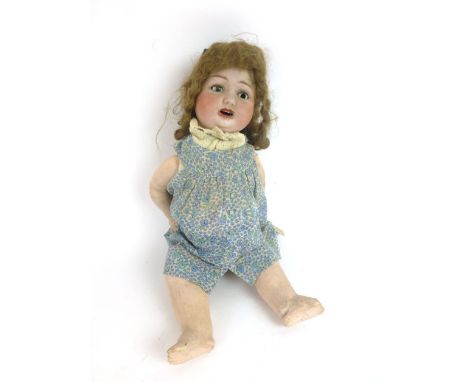  A ceramic bisque headed doll, stamped DRCM THURINGIA to base of head, with tilt swivel green glazed eyes (one eye damaged/mi