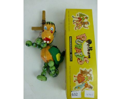 A boxed Pelham puppet of a baby dragon in original box  CONDITION REPORT: Good condition 