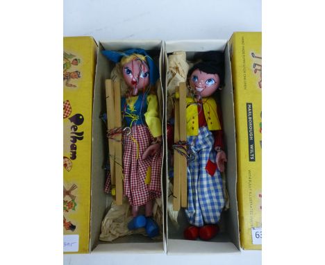 A boxed Pelham puppet, a SS Dutch boy in original box together with SS Dutch girl, both original boxes appear complete