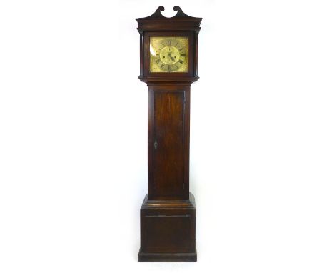 An early 18th century oak and mahogany longcase eight day clock, the brass face with Roman numerals, second dial date apertur