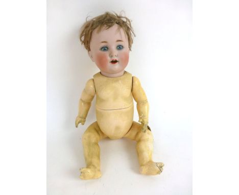 A ceramic bisque headed doll, stamped 201 Germany to back of head, with original brown wig, composite full jointed spring bod