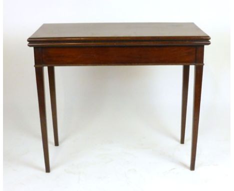 A late 18th century mahogany fold over tea table with double gate action on square tapering legs, h. 73 cm, w. 86 cm, d. 43 c