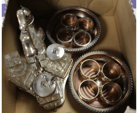 A BOX CONTAINING A SELECTION OF DOMESTIC SILVER PLATE to include a pair of 19th century wine bottle coasters, a table cruet, 