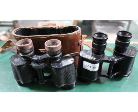 A CASED PAIR OF 8 X 30 BINOCULARS by E. Leitz Wetzlar, together with a pair of Taylor Hobson branded wartime binoculars 
