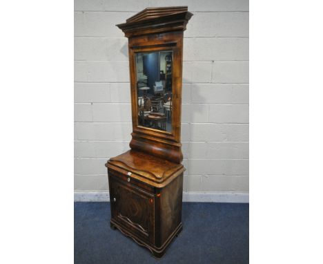 A VICTORIAN FLAME MAHOGANY CABINET, with rectangular mirror back, the top with art deco style cornice, cushion frame, over a 