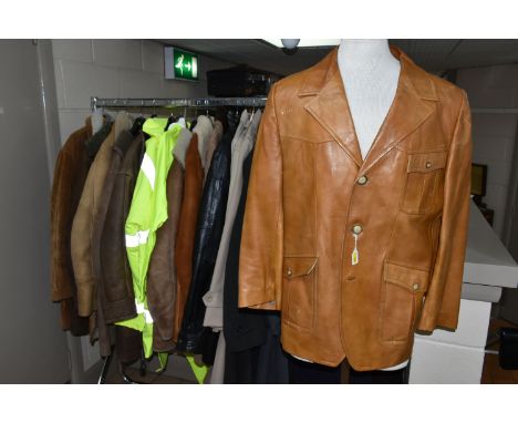 A LARGE QUANTITY OF VINTAGE GENTLEMEN'S OVERCOATS AND JACKETS, to include a tan coloured 1970's leather jacket (missing butto