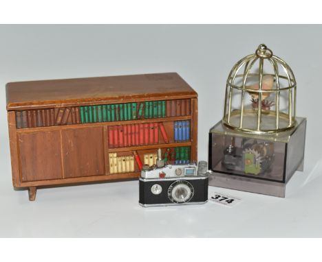 A PHENIX CAMERA LIGHTER AND TWO MUSICAL ITEMS, to include the Phenix novelty lighter in the form of a camera with tiny compas
