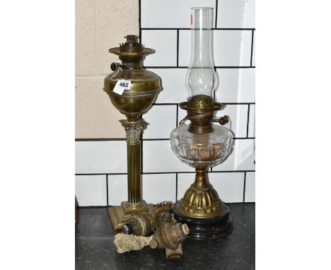 TWO VICTORIAN OIL LAMPS AND THREE SPARE BURNERS, comprising three brass oil lamp burners complete with wick, a German brass C