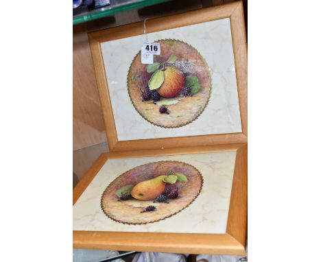 TWO FRAMED HAND PAINTED CERAMIC PLAQUES, signed M. Harnett, painted with fruit in a central circular panel on a marble effect