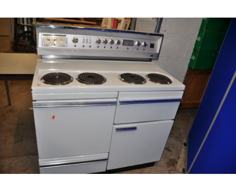 A VINTAGE G.E.C. ELECTRIC RANGE COOKER with four top rings, two oven, one grill and drawer width 107cm depth 63cm total heigh